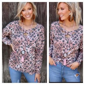 LAST ONE-LARGE...Criss-cross neckline, leopard print top/relaxed fit